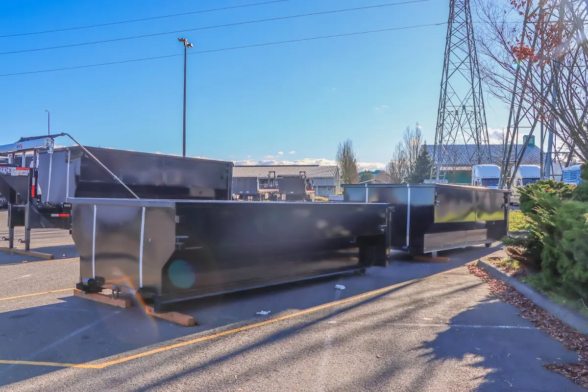 Roll-off dumpster ready for waste disposal at job site for Concrete Dumpster Rental in North Bend